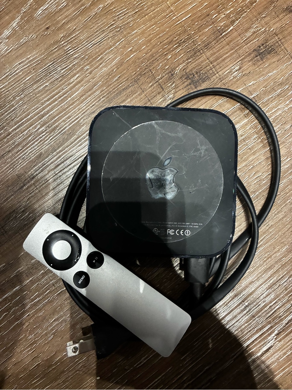 Apple TV (black) with silver Siri Remote